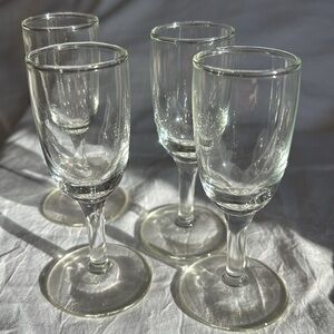 Sleek shot glasses from the 1950s, set of four measuring 4” tall.
